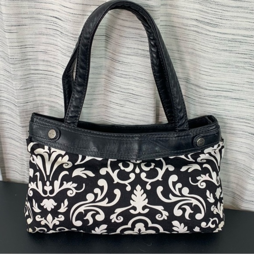 Thirty-one black and white floral and paisley hand bag.